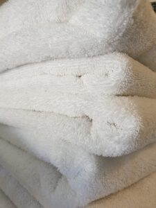 getting things done around the house white folded towels